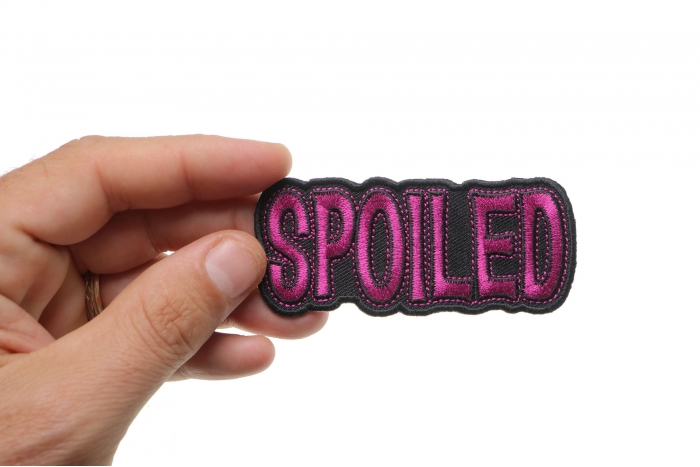 Spoiled Patch shown on hand for size comparison