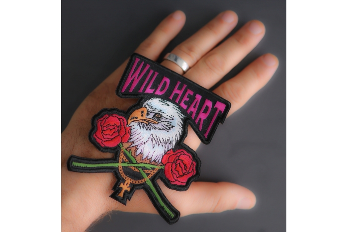Wild Heart Eagle Rose Patch shown on hand for size comparison
