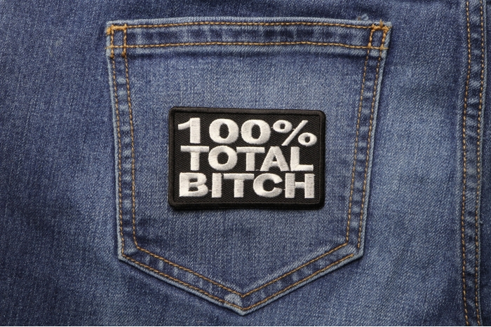 100 Percent Total Bitch Patch shown on jeans