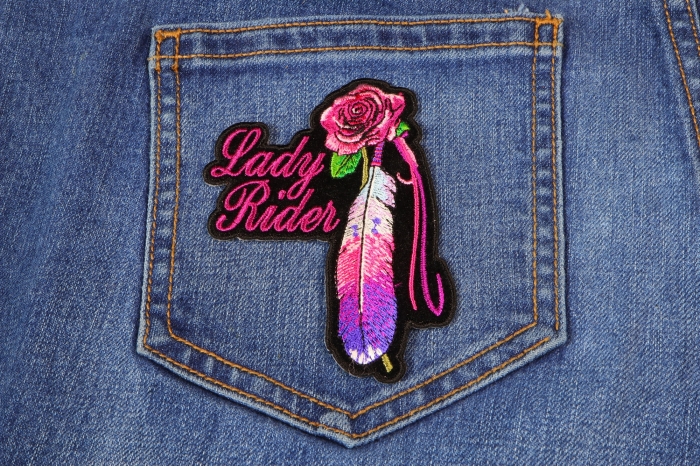 Lady Rider With Purple Rose and Feather Vertical Small Patch shown on jeans