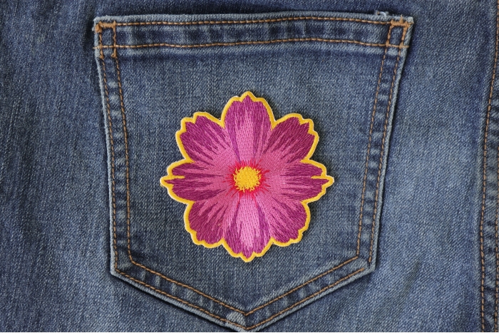 Pink Flower Patch shown on jeans