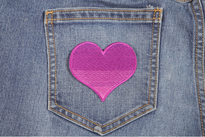 Pink Heart Iron on Patch shown on jeans