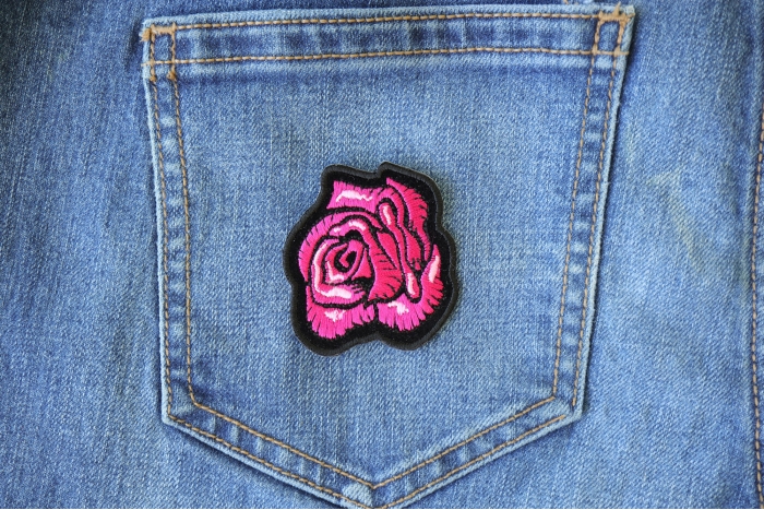 Pink Rose Patch shown on jeans