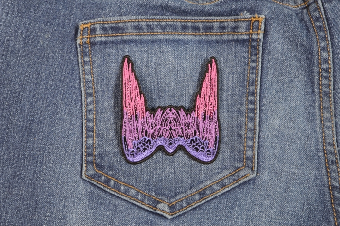 Small Angel Wings Biker Patch Pink shown on jeans