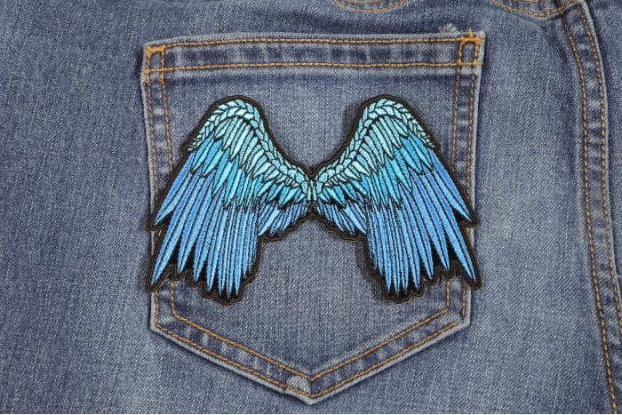 Small Beautiful Angel Wings Blue Patch shown on jeans