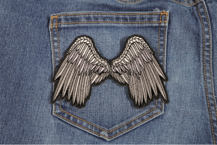 Small Beautiful Angel Wings Grey Biker Patch shown on jeans