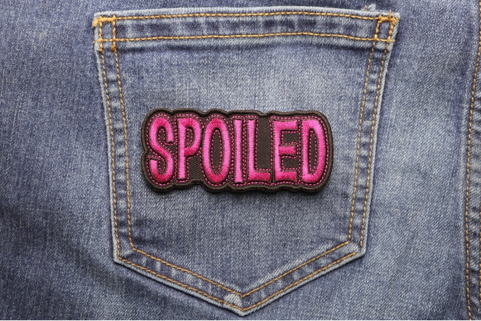 Spoiled Patch shown on jeans