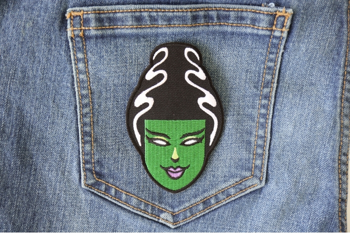 Lady in Green Iron on Patch shown on jeans