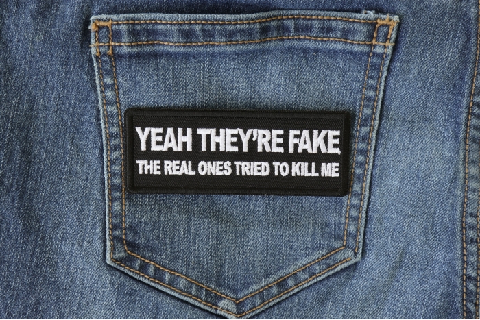 Yeah They're Fake The Real Ones Tried to Kill me Patch shown on jeans