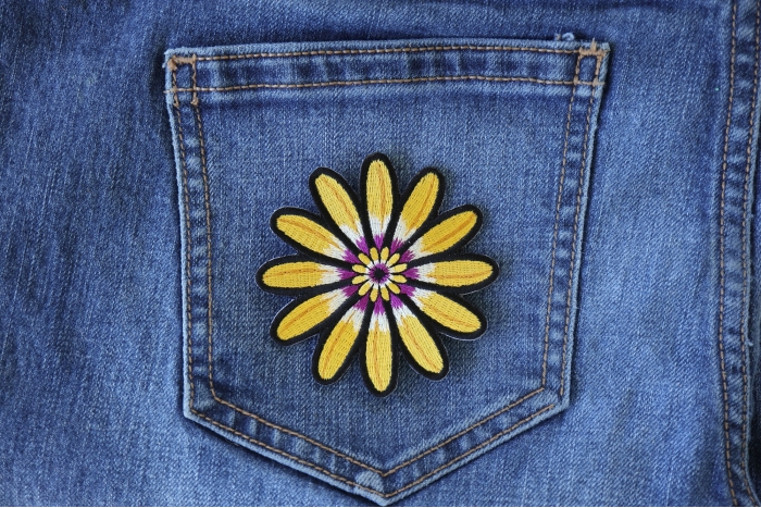 Yellow Flower Patch shown on jeans