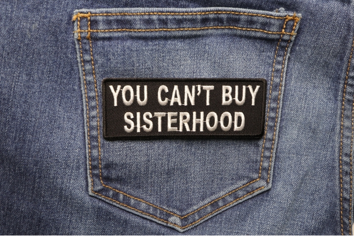 You Can't Buy Sisterhood Patch shown on jeans