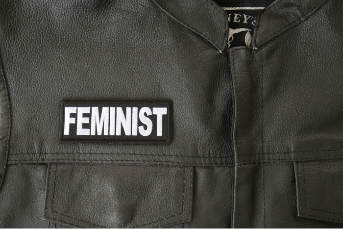 Feminist Patch - 4x1.5 inch - Embroidered Iron on Patch shown on leather vest