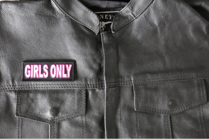 Girls Only Patch - 4x1.5 inch - Embroidered Iron on Patch shown on leather vest