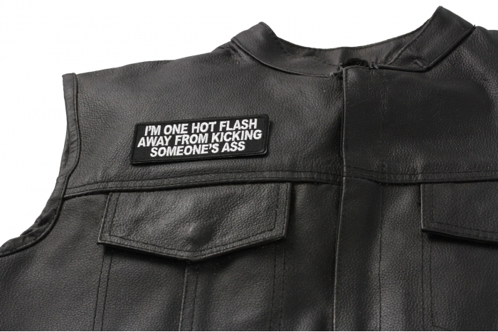 I'm One Hot Flash Away from Kicking Someone's Ass Patch - 4x1.5 inch. Embroidered Iron on Patch shown on leather vest