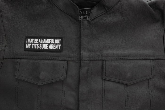 I may be handful but my tits sure aren't patch shown on leather vest