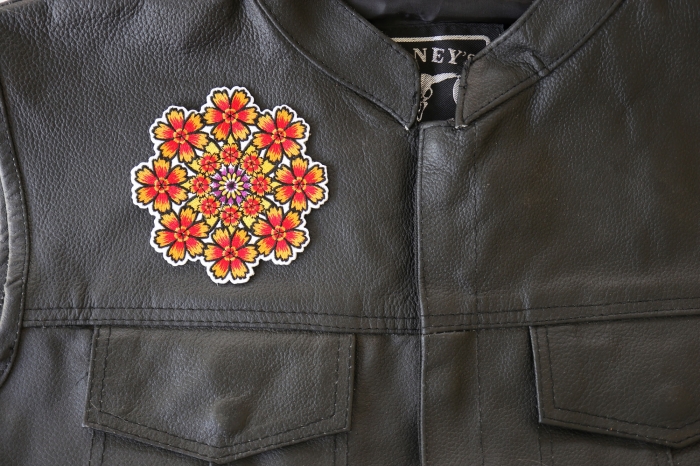 Kaleidoscope Flowers Patch - 4x4 inch. Embroidered Iron on Patch shown on leather vest