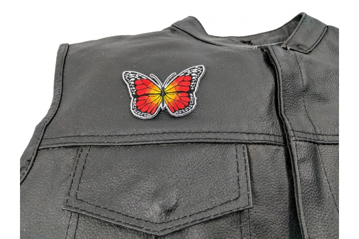 Orange Butterfly Iron On Patch - 3x2 inch. Embroidered Iron on Patch shown on leather vest