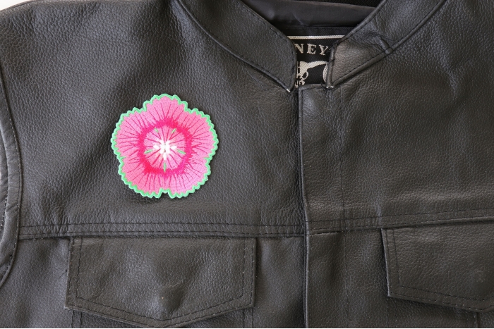 Pink and Green Flower Patch - 3x3 inch. Embroidered Iron on Patch shown on leather vest