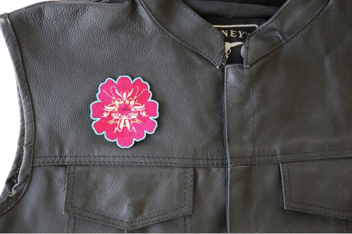Pink Flower Patch - 2.8x3 inch. Embroidered Iron on Patch shown on leather vest