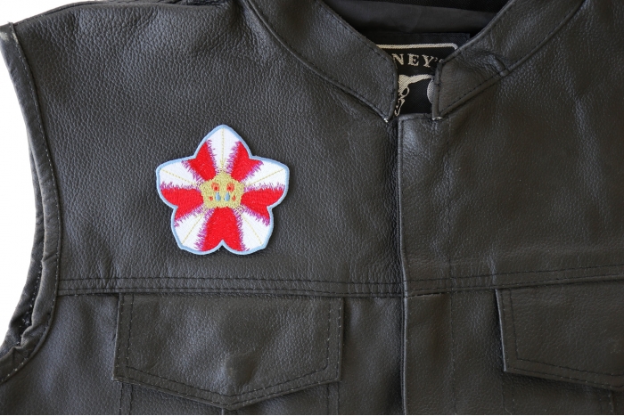 Pink White Flower Patch - 3x3 inch. Embroidered Iron on Patch shown on leather vest