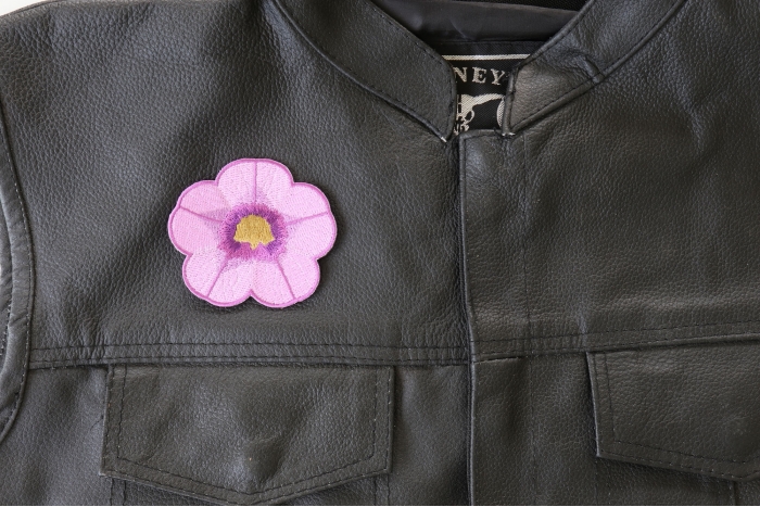 Purple Flower Patch - 3x3 inch. Embroidered Iron on Patch shown on leather vest