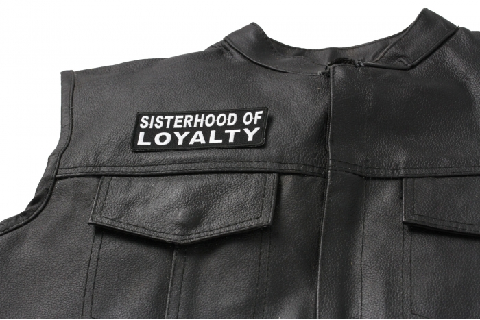 Sisterhood Of Loyalty Patch - 4x1.5 inch. Embroidered Iron on Patch shown on leather vest