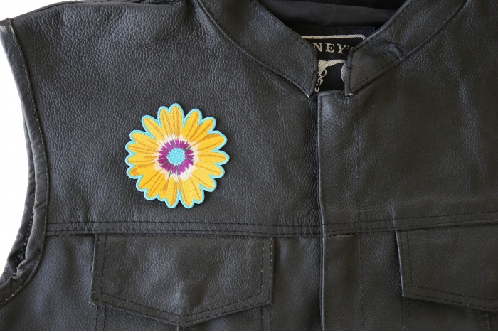 Yellow Blue Pink Flower Patch - 3x3 inch. Embroidered Iron on Patch shown on leather vest