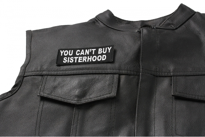 You Can't Buy Sisterhood Patch - 4x1.5 inch. Embroidered Iron on Patch shown on leather vest