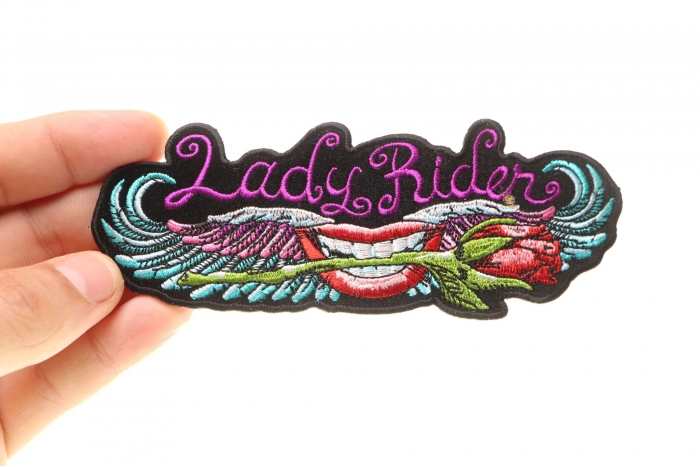 Lips and roses Lady Rider Iron on Biker Patch shown on hand for size comparison