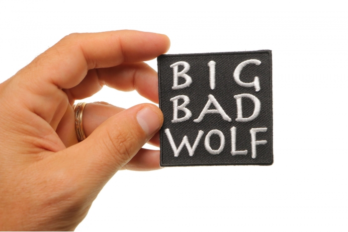 Big Bad Wolf Funny Iron on Patch shown on hand for size comparison