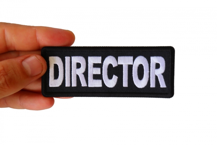 Director Patch shown on hand for size comparison