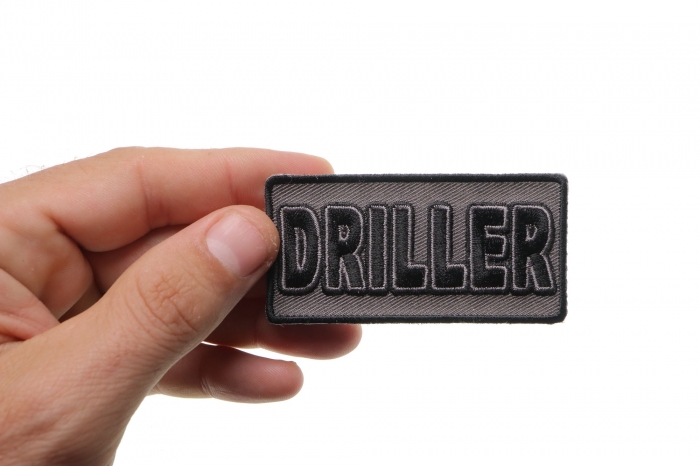 Driller Patch shown on hand for size comparison