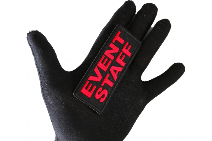 Event Staff Patch Red shown on hand for size comparison