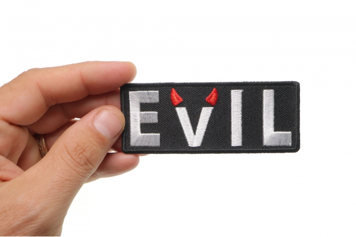 Evil Patch With Devil Horns shown on hand for size comparison