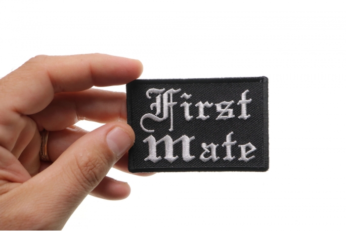 First Mate Patch In Old English shown on hand for size comparison