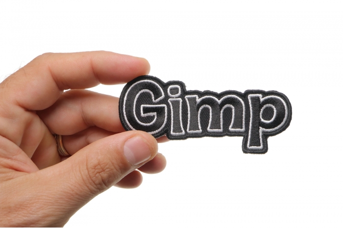 Gimp Funny Iron on Patch shown on hand for size comparison