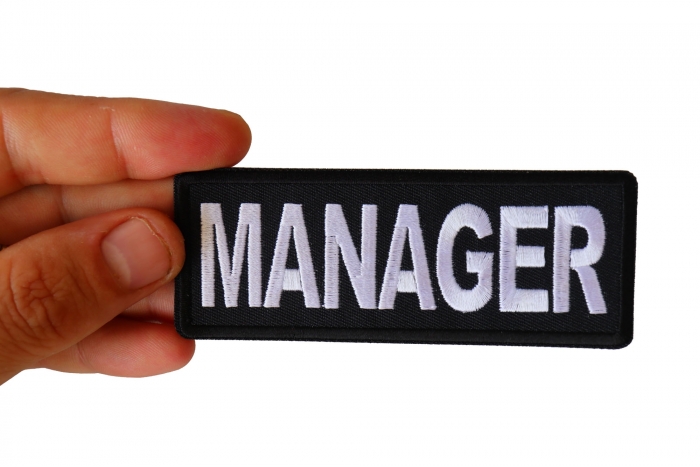 Manager Patch shown on hand for size comparison