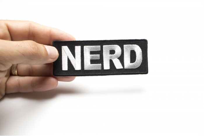 Nerd Funny Iron on Patch shown on hand for size comparison