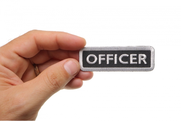 Officer Name Tag Patch shown on hand for size comparison