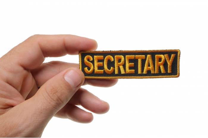 Secretary Patch, Motorcycle Club Patches for Bikers shown on hand for size comparison