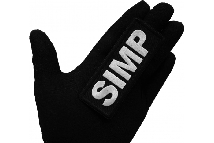 Simp Iron on Patch shown on hand for size comparison