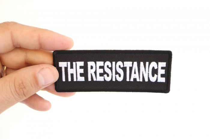 The Resistance Patch shown on hand for size comparison