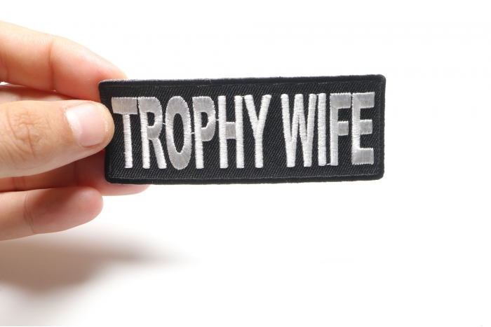 Trophy Wife Patch, Funny Patches for Ladies shown on hand for size comparison