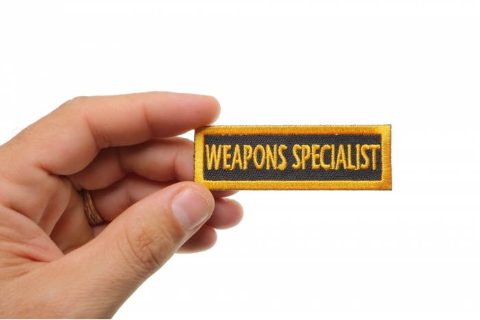 Weapons Specialist Patch, Military Saying Patches shown on hand for size comparison