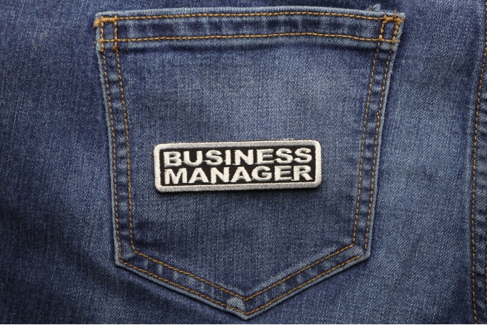 Business Manager Patch shown on jeans