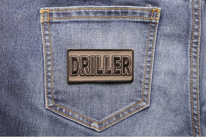 Driller Patch shown on jeans