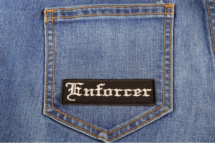 Enforcer Patch In Old English shown on jeans