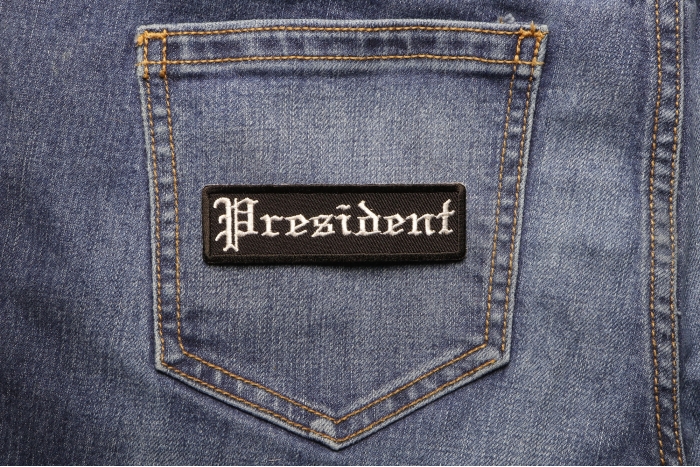 President Patch In Old English shown on jeans