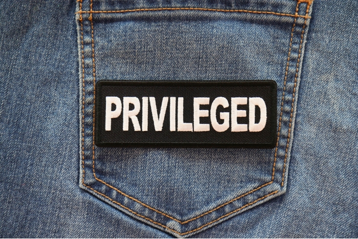 Privileged Patch shown on jeans