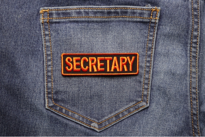 Secretary Patch 3.5 Inch Orange shown on jeans